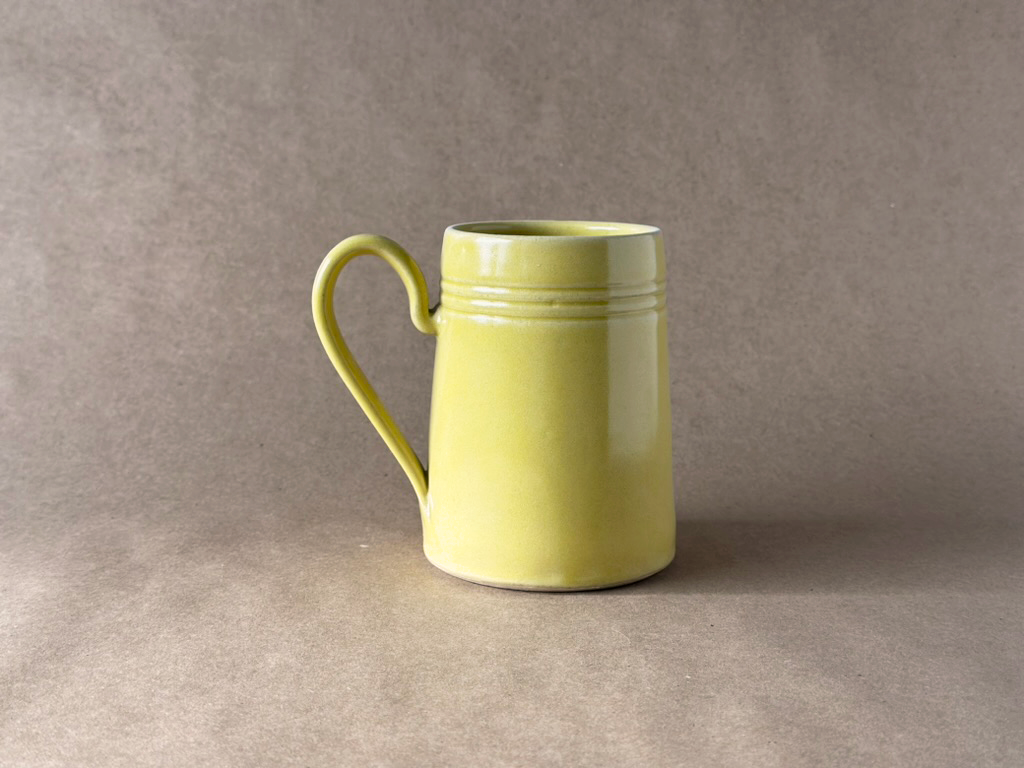 Yellow Tankard Mug with a brown backdrop