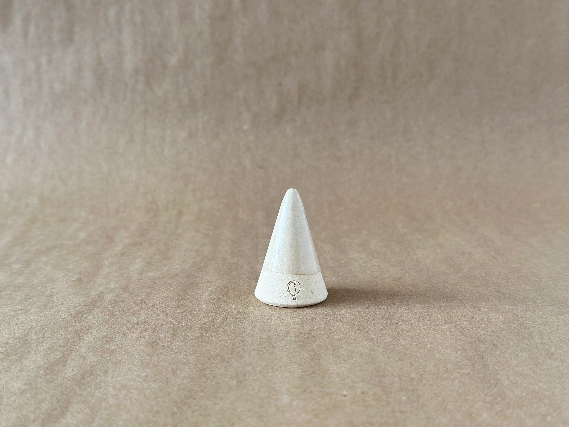 Linen Ring Cone on a brown backdrop